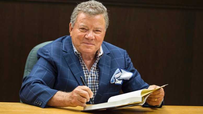 shatner signing book 7 New Things We Learned From William Shatner’s Revealing Memoir ‘Live Long and…’